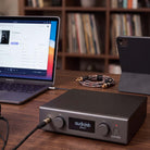 Audiolab PPA7 Phono Preamplifier - Black - lifestyle photo of unit on desk to right of laptop