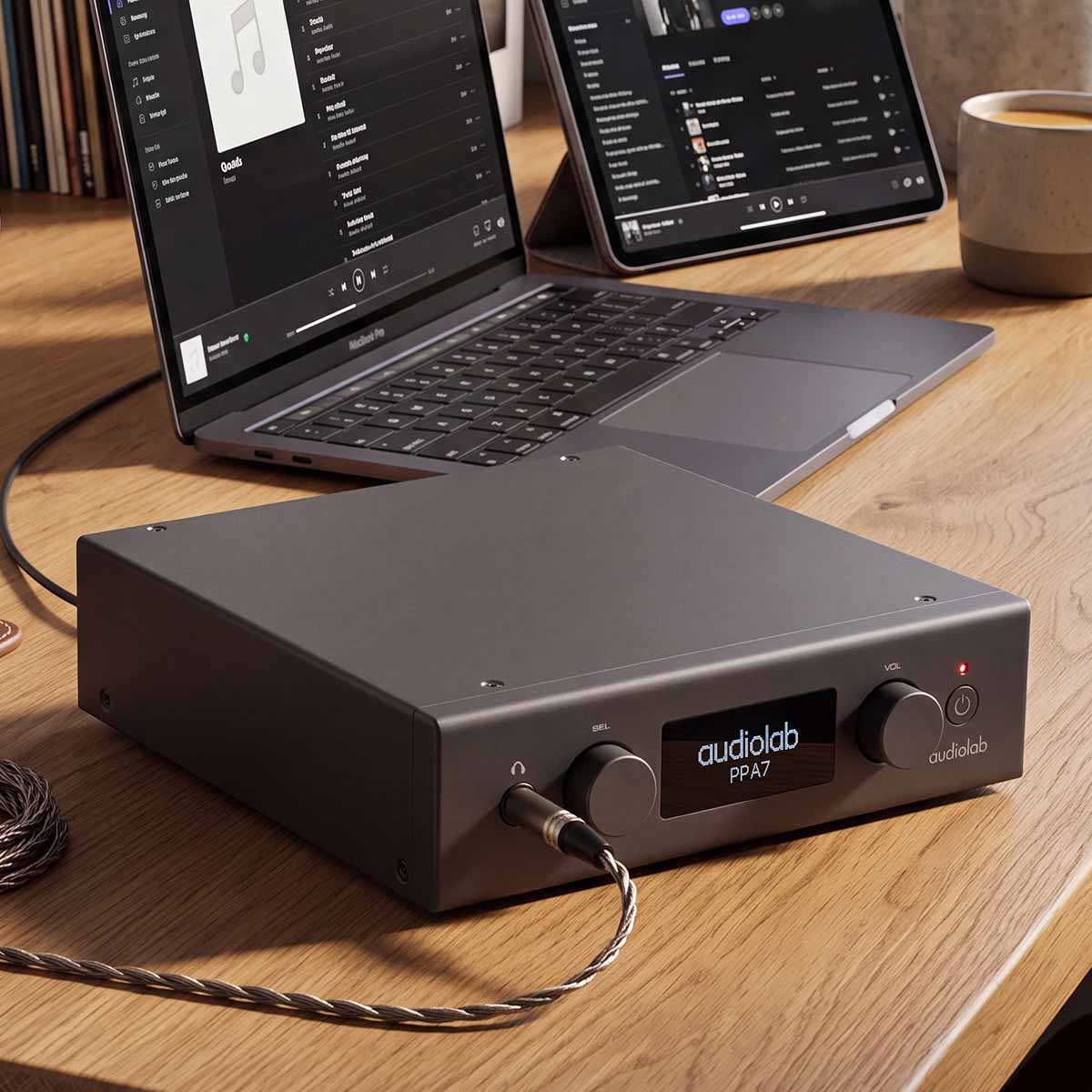 Audiolab PPA7 Phono Preamplifier - Black - lifestyle photo of unit on desk in front of laptop