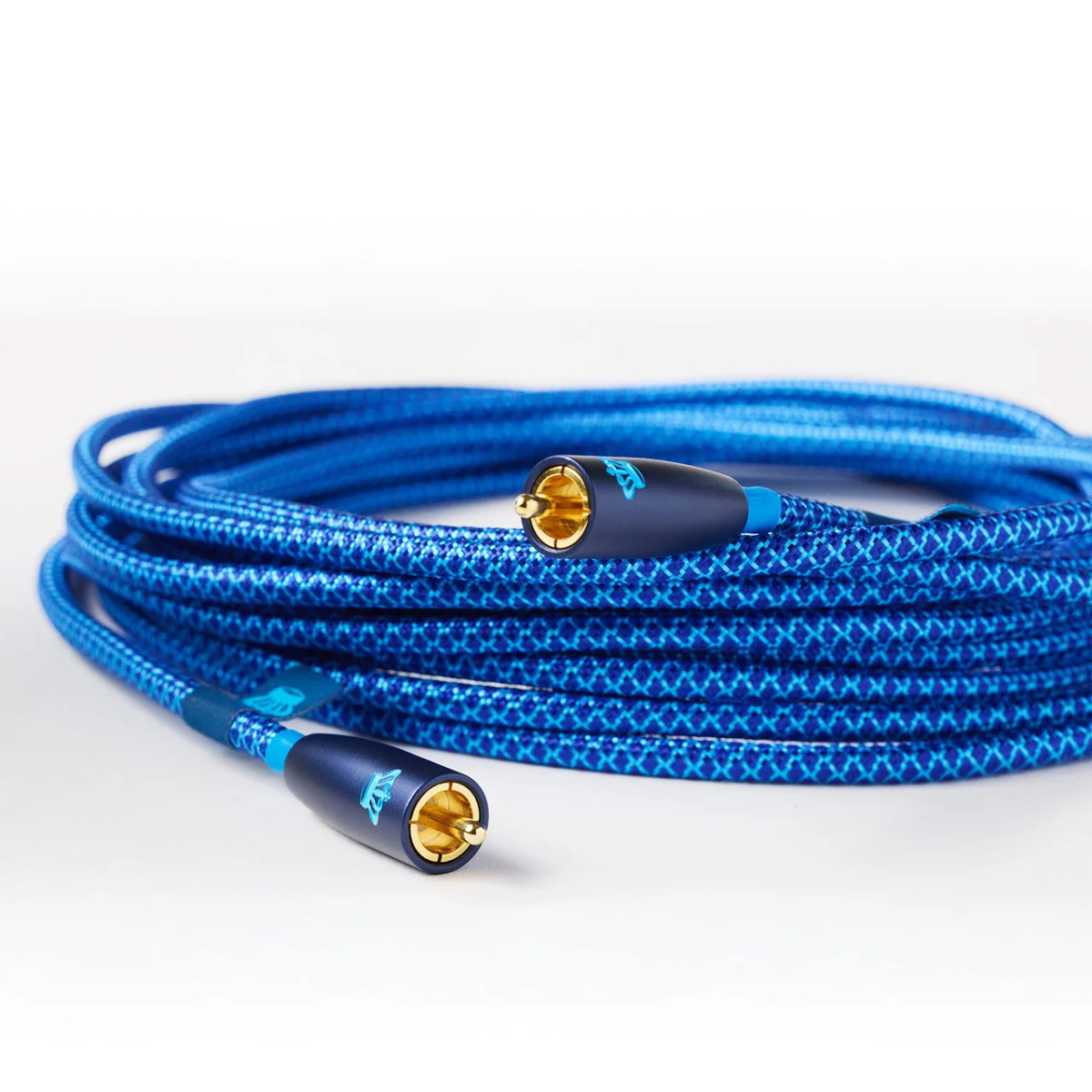 A coiled blue braided audio cable with gold-plated RCA connectors, photographed on a clean white background.