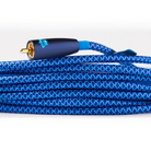 Blue braided REL Acoustics Commodore .1/LFE Subwoofer Cable with a gold-plated RCA connector and a dark blue protective sleeve, coiled on a white background.