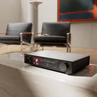 HiFi Rose RS451 Network Streamer and DAC - silver - front view angled left lifestyle photo of unit in living room