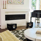 REL Acoustics S/550 Subwoofer - black - lifestyle photo two subwoofers to either side of fireplace without grilles