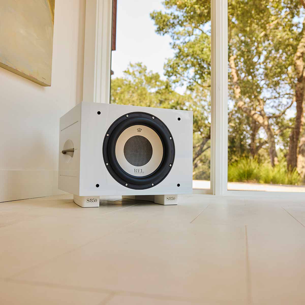 REL Acoustics S/850 Subwoofer - white - lifestyle photo of subwoofer in light room no grille