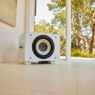 REL Acoustics S/850 Subwoofer - white - lifestyle photo of subwoofer in light room no grille