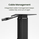 Black adjustable desk with integrated cable management system on a white background