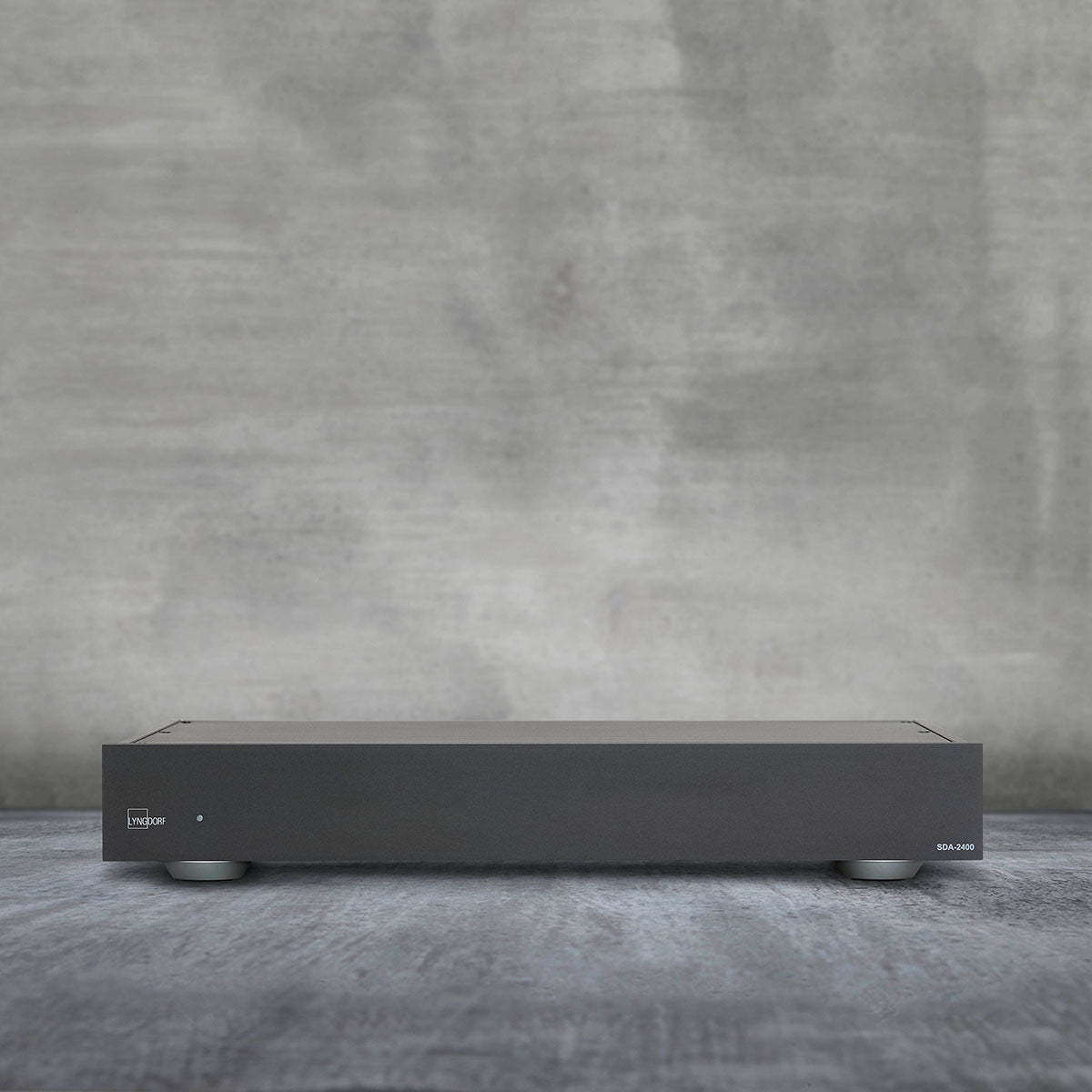 Lyngdorf SDA-2400 Stereo Semi-Digital Power Amplifier front view of unit on gray background