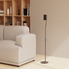 Modern living room with a beige sofa and a floor lamp.