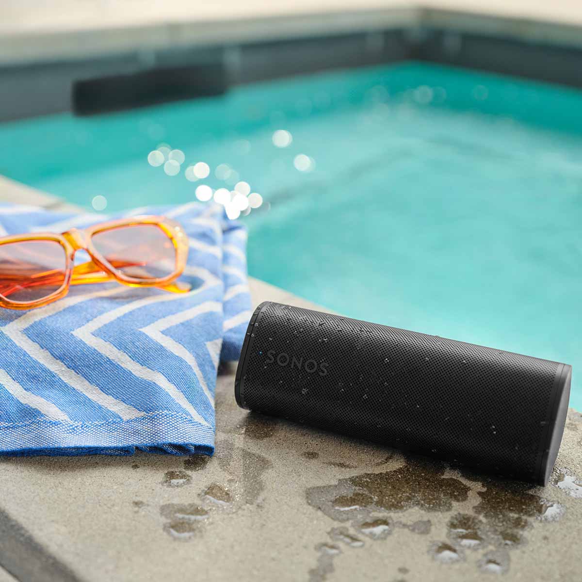 Sonos Roam 2 Portable Waterproof Smart Speaker - black - lifestyle photo speaker next to pool