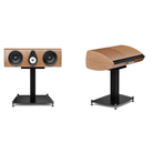 Two views of a wooden speaker on a black stand against a white background: a front three-quarter view on the left and a side profile on the right, both showing a light natural wood finish with black and silver speaker components.