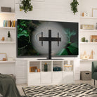 Modern living room with a TV mounted on a white wall, surrounded by decorative items.