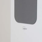 Lyngdorf FR-2 Speaker - closeup of Lyngdorf logo on white speaker with light grey grille