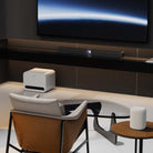 WiiM Bar 3.0.2 Soundbar with Dolby Atmos - Gloss Black - lifestyle photo of soundbar below TV on cabinet in living room