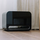 WiiM Sub Pro Wireless Smart Subwoofer - gloss black - lifestyle image