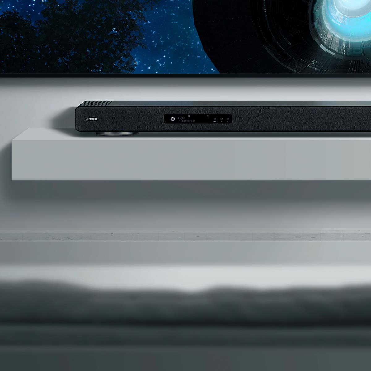 Yamaha True X Surround 90A Soundbar/Surround Sound System - soundbar below TV on shelf