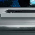 Yamaha True X Surround 90A Soundbar/Surround Sound System - soundbar below TV on shelf