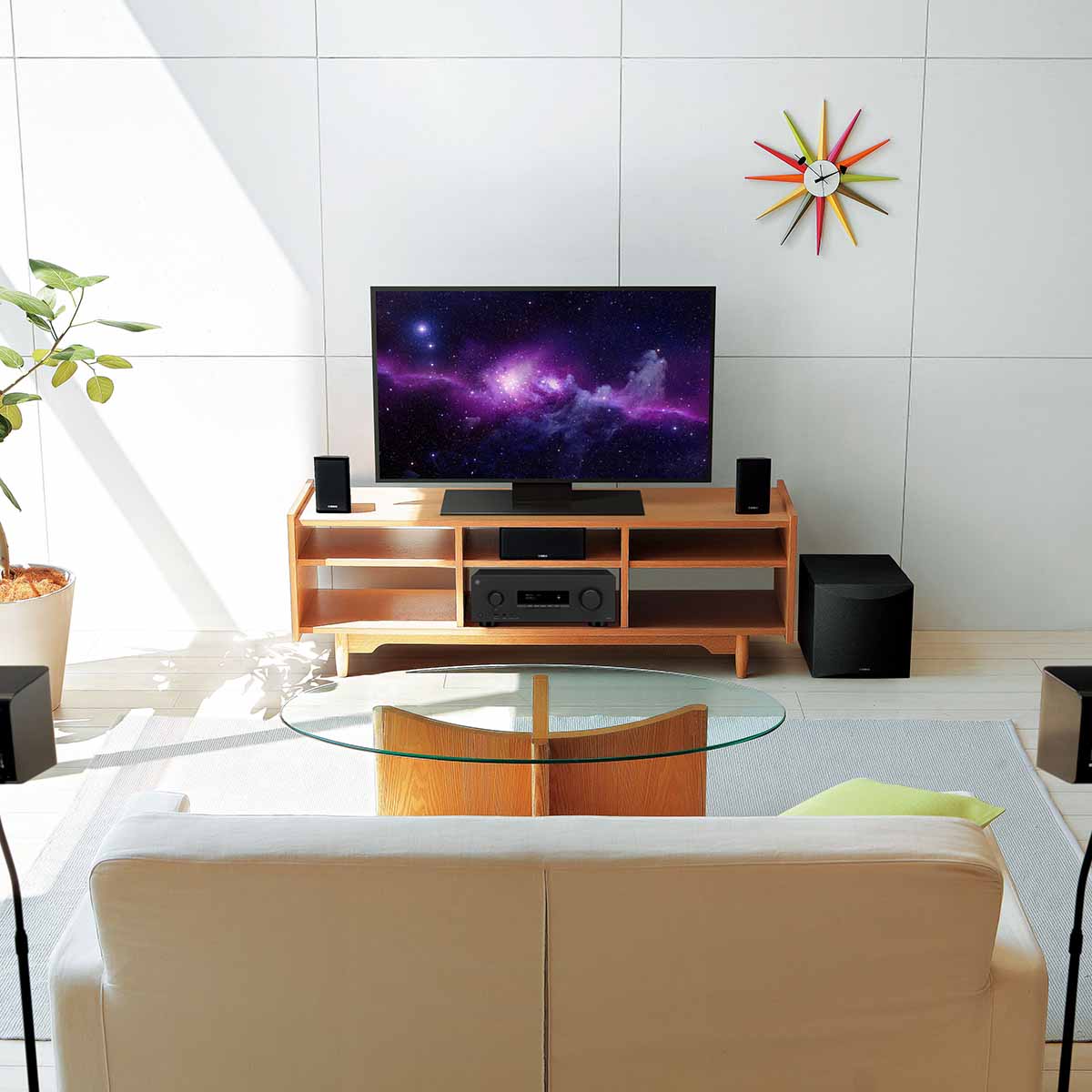 Yamaha YHT-4970U 5.1-Channel Home Theater System - lifestyle image of system set up around TV in living room
