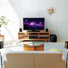 Yamaha YHT-4970U 5.1-Channel Home Theater System - lifestyle image of system set up around TV in living room