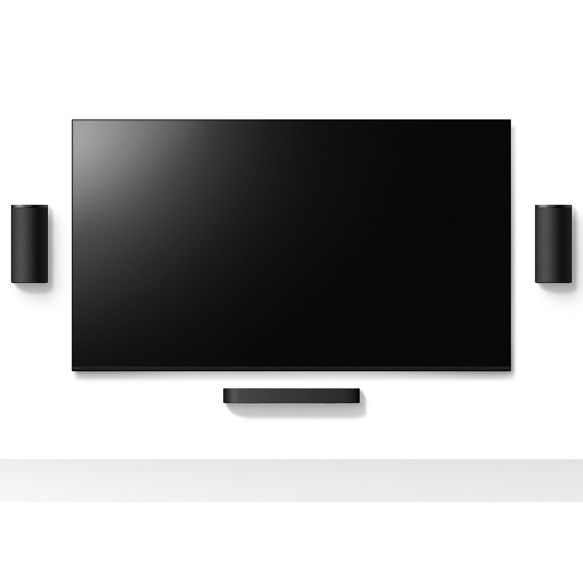 Sony BRAVIA Trio Home Theater System mounted on wall around a TV