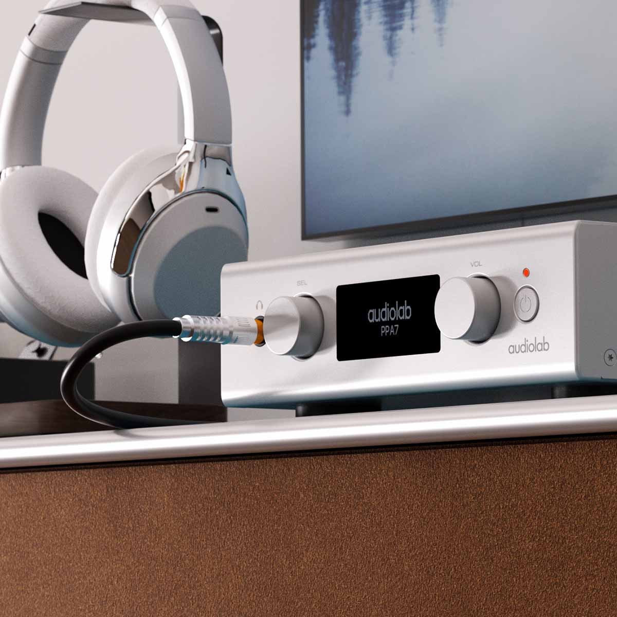 Audiolab PPA7 Phono Preamplifier - Silver - lifestyle photo of unit on cabinet to right of headphones on stand