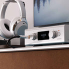 Audiolab PPA7 Phono Preamplifier - Silver - lifestyle photo of unit on cabinet to right of headphones on stand