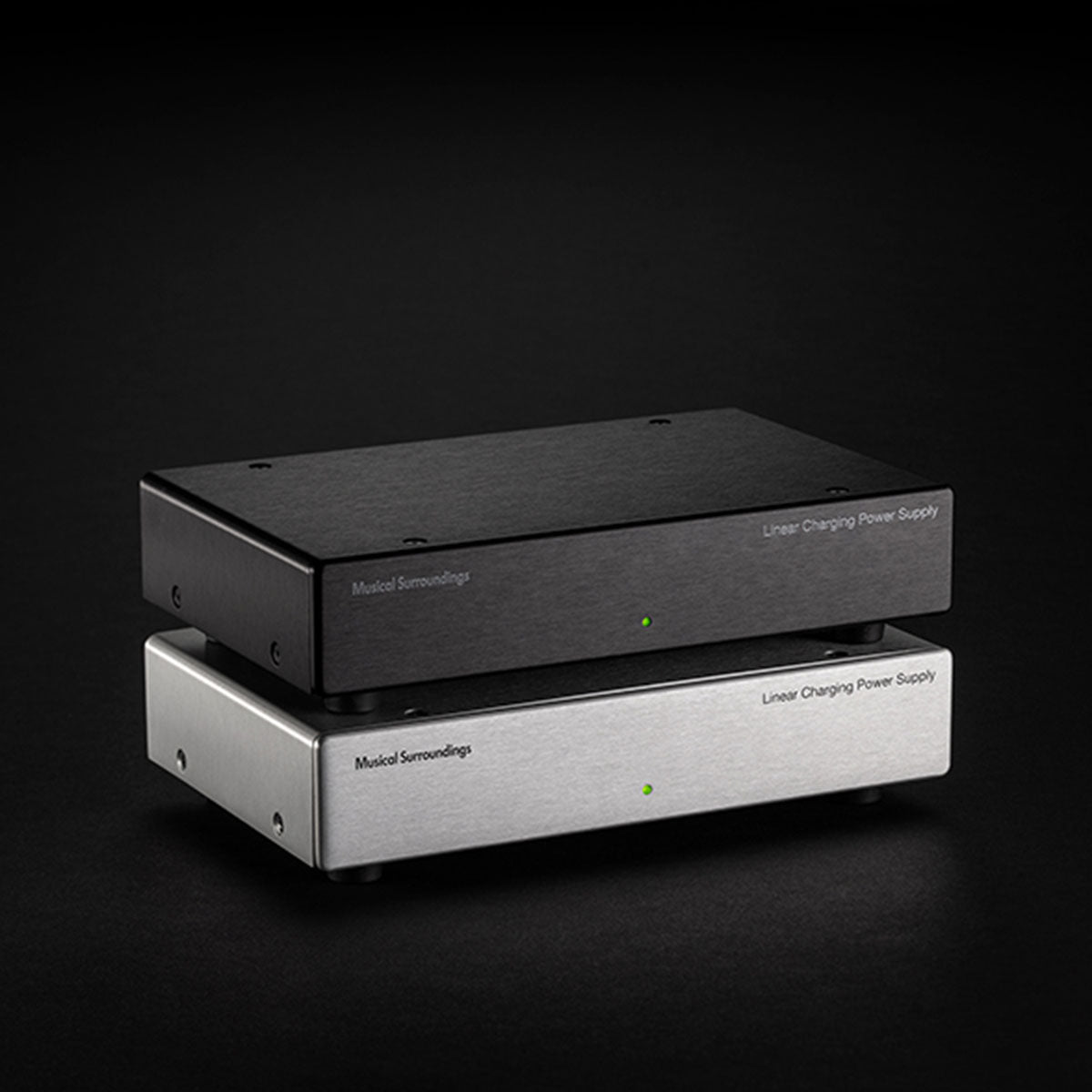 Musical Surroundings Linear Power Supply - front view of two stacked units angled right, black unit on top and silver unit on bottom