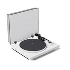 White turntable with clear dust cover on a white background