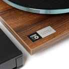Rega Planar 3 50th Anniversary Edition Turntable - Walnut close-up of 50th anniversary badge next to Neo PSU