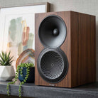 Paradigm Premier 120B V2 Bookshelf Speaker - Each walnut on granite shelf