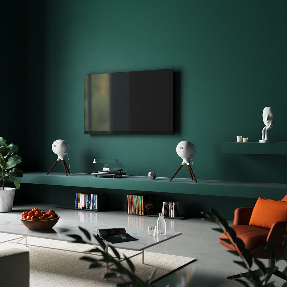 Devialet Phantom I Wireless Speakers, Light Chrome, in dark green media room on either side of a television