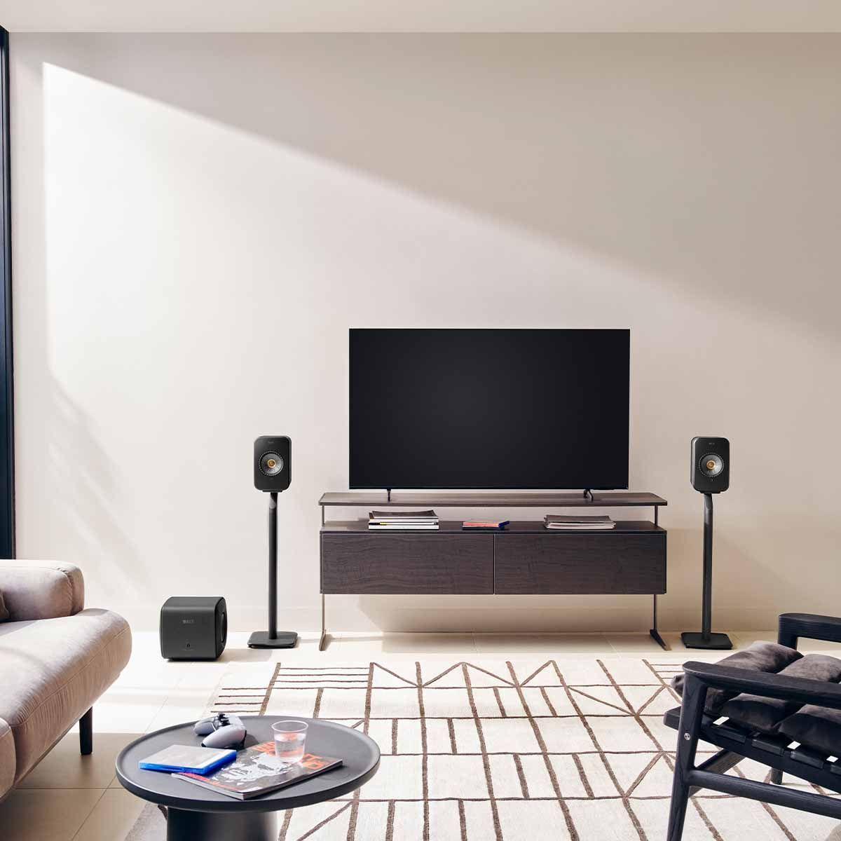 KEF LSX II Wireless HiFi Speakers - on floor stands with TV and subwoofer
