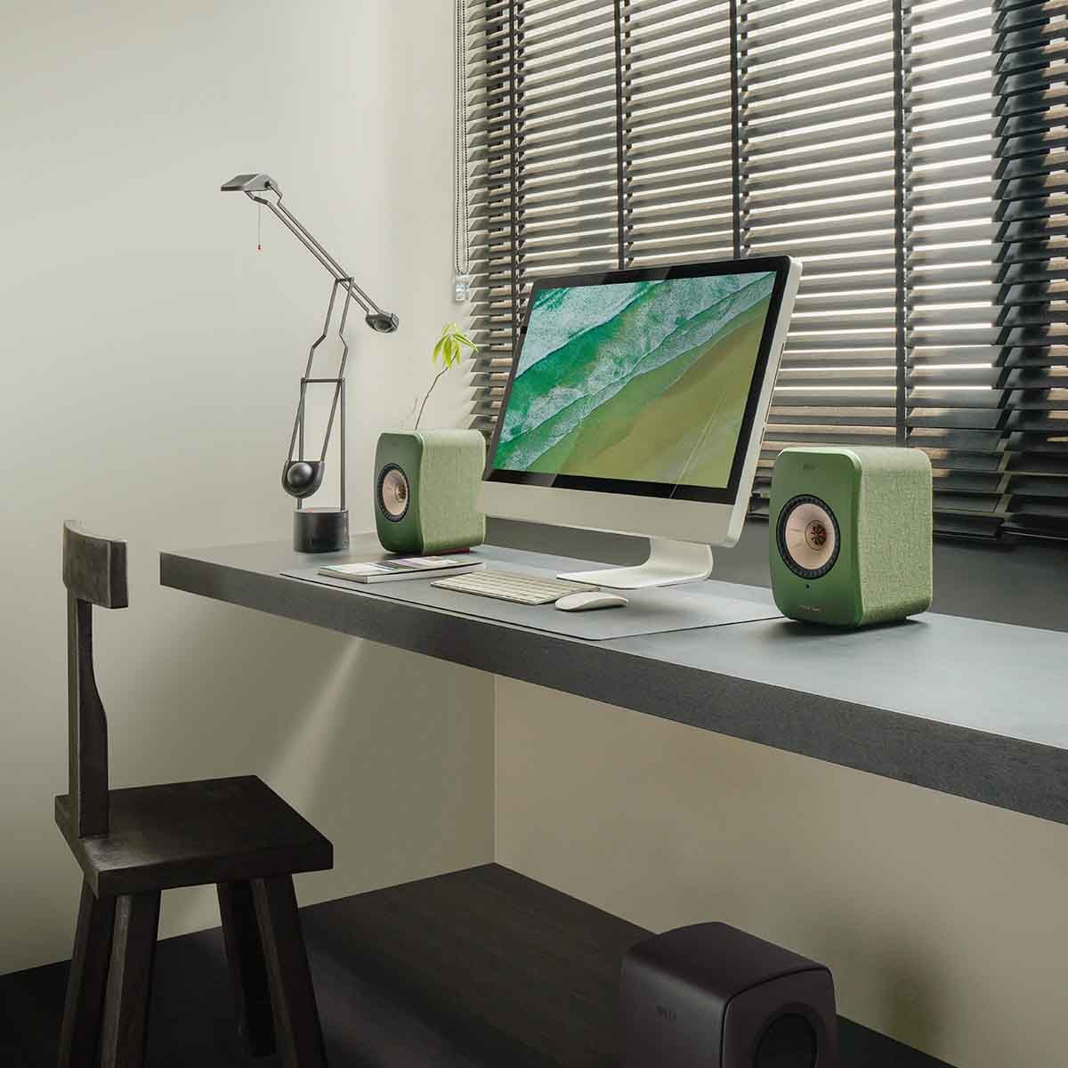 KEF LSX II Wireless HiFi Speakers - Olive Green - on desk with computer