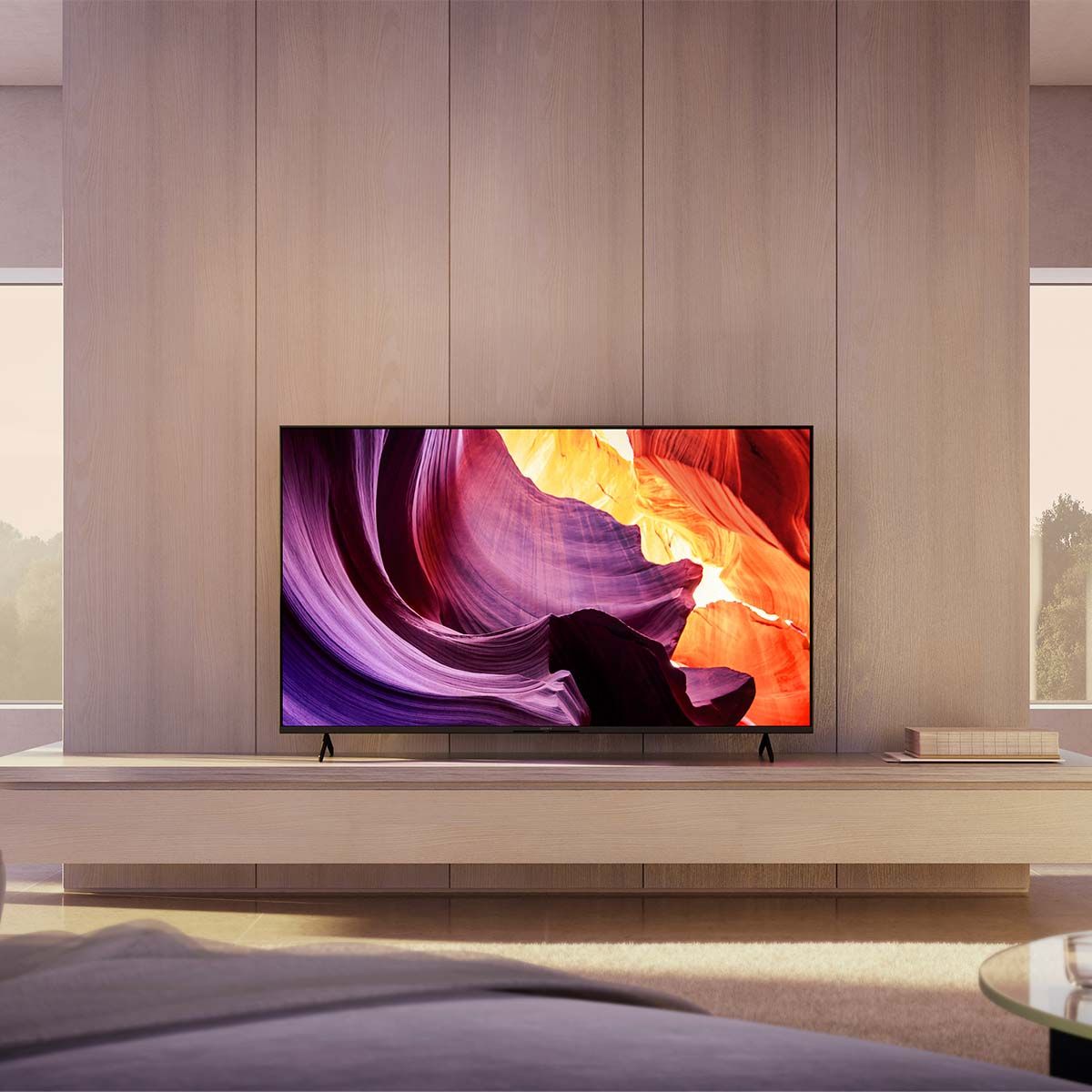 Sony X80K 4K LED Television, in a light-colored media room against a wood wall