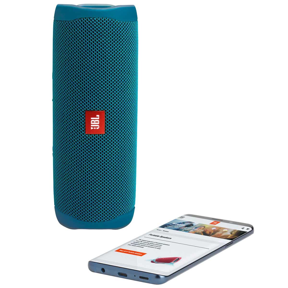 JBL Flip 5 Eco Edition Waterproof Bluetooth Speaker - Ocean Blue standing on end with phone
