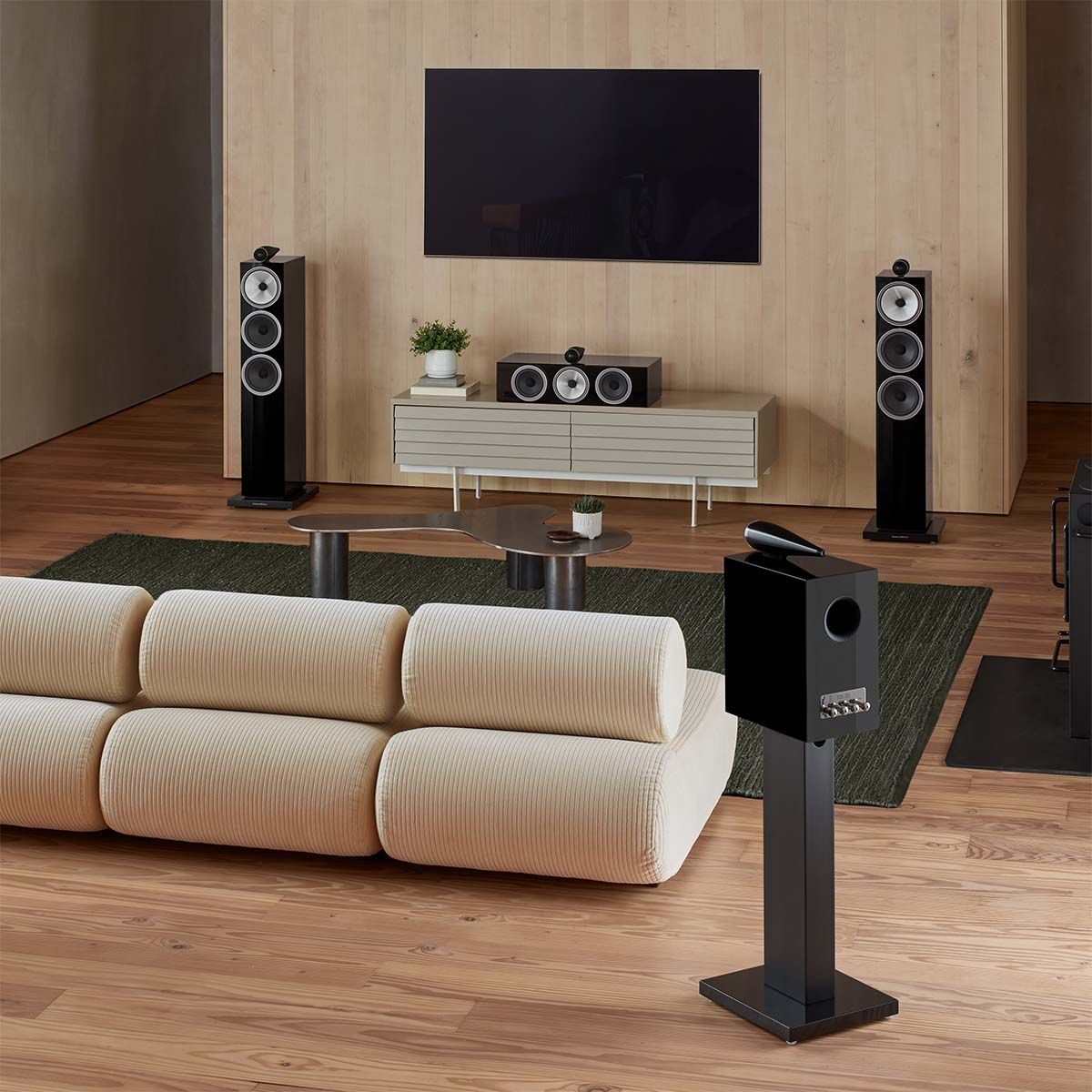 Photo showing Bowers & Wilkins 703 S3 3-Way Floorstanding Loudspeakers set up in living room being used as home theater speakers