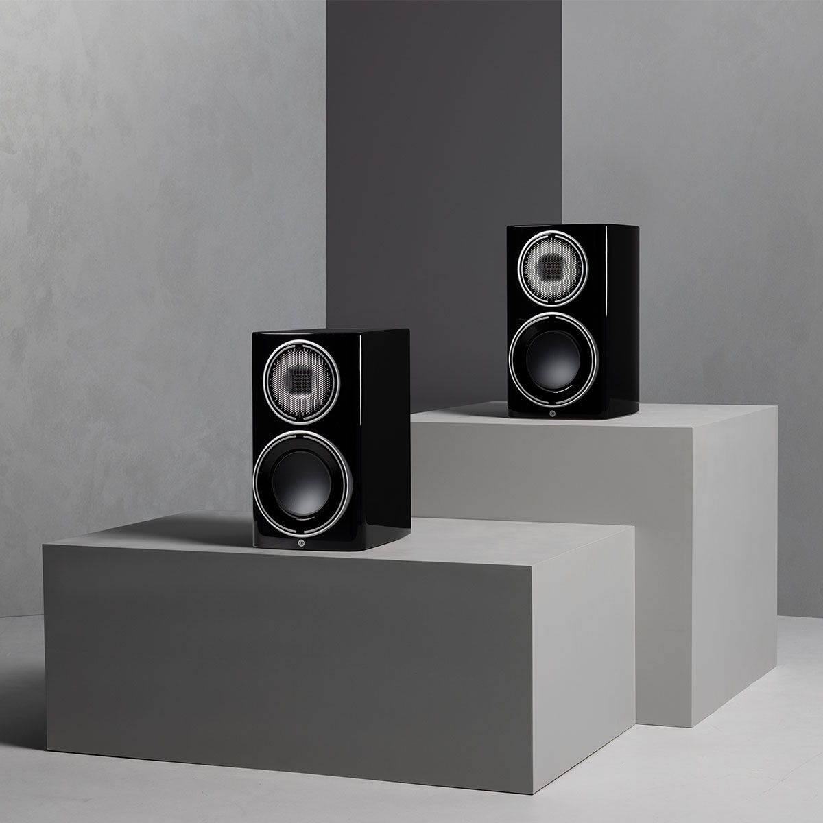 Monitor Audio Platinum 100 3G Bookshelf Loudspeaker - piano black pair on grey blocks