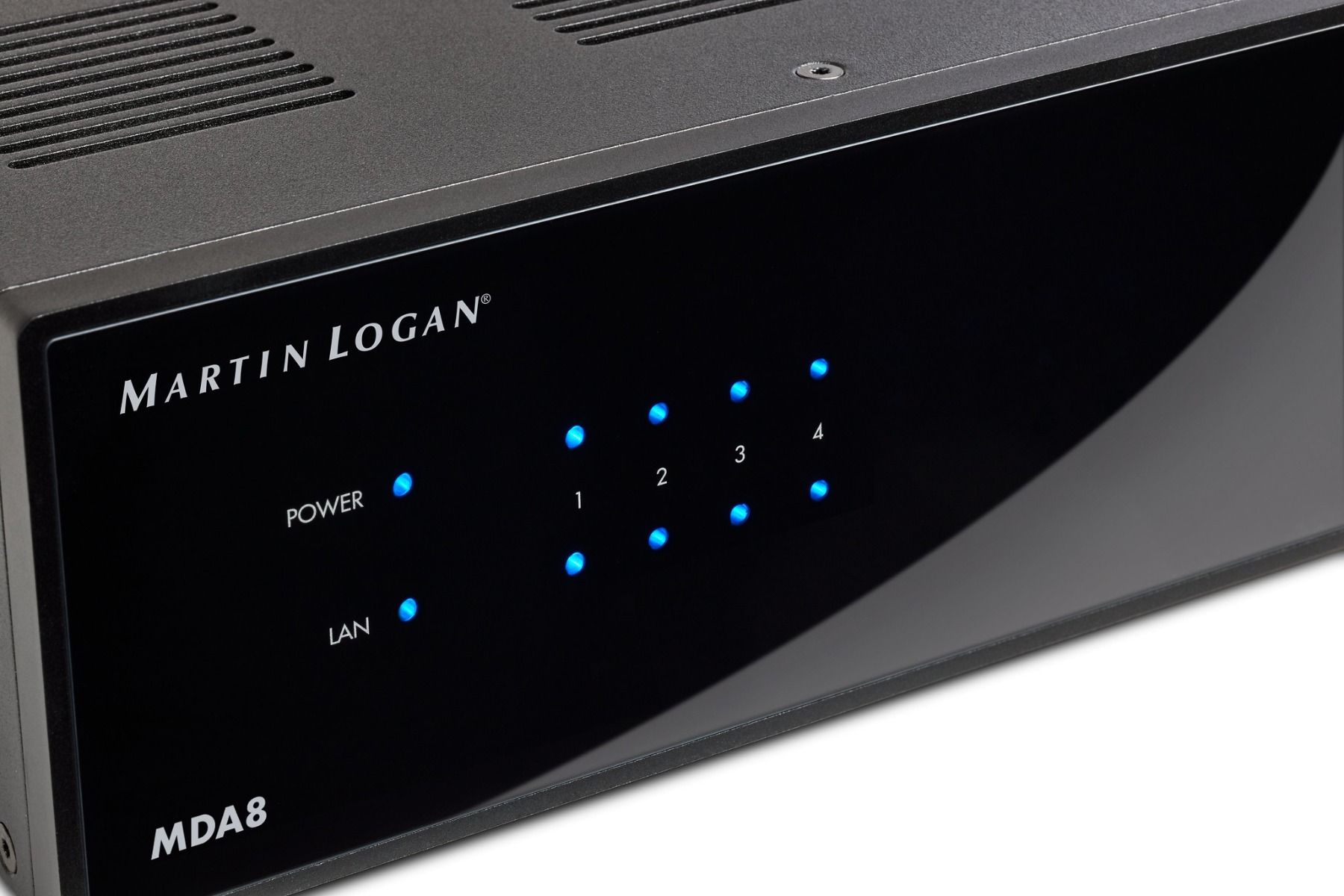 Upc close view of MartinLogan MDA8 Amplifier at an angle on white background with lights illuminated