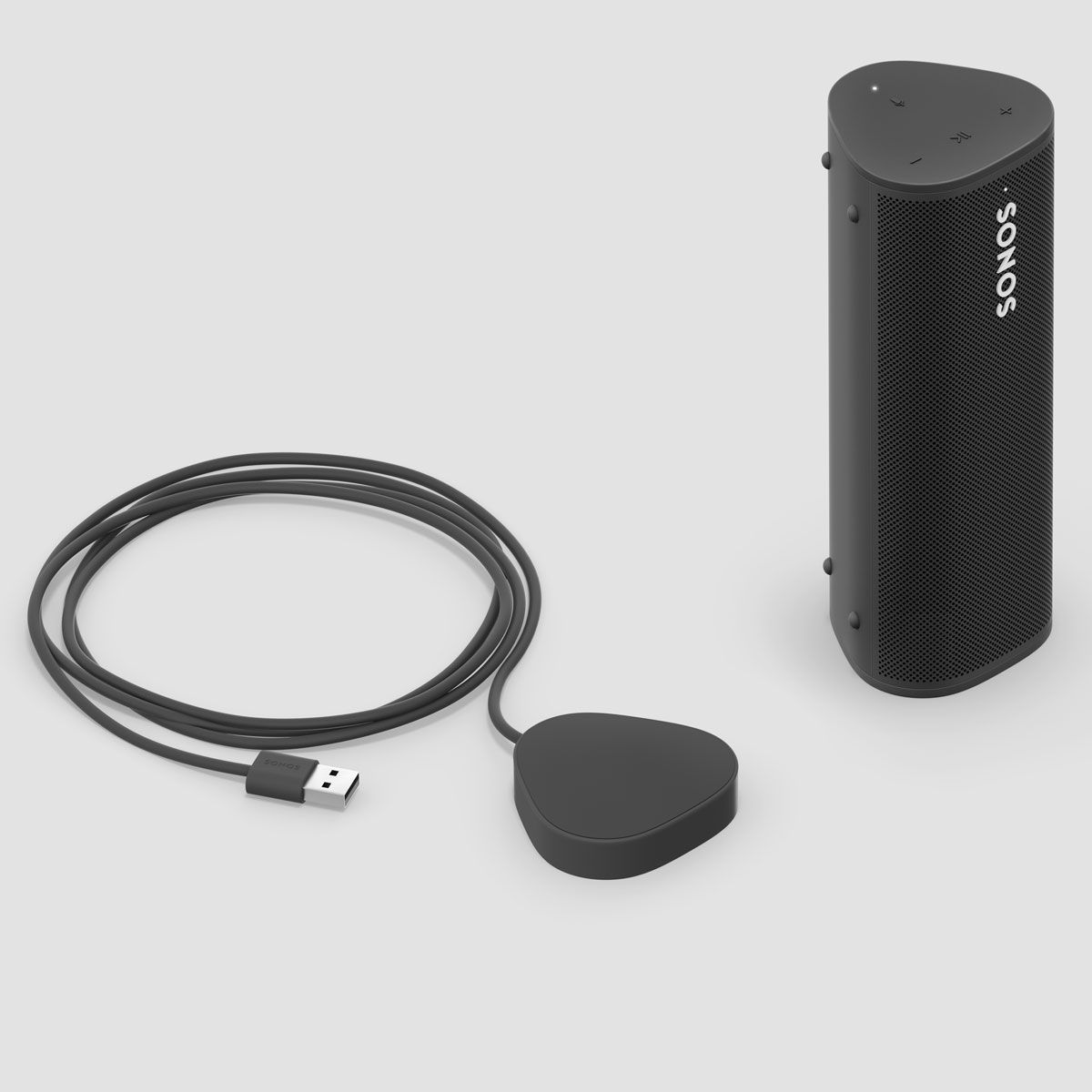 Sonos Roam next to Wireless Charging Base in Black