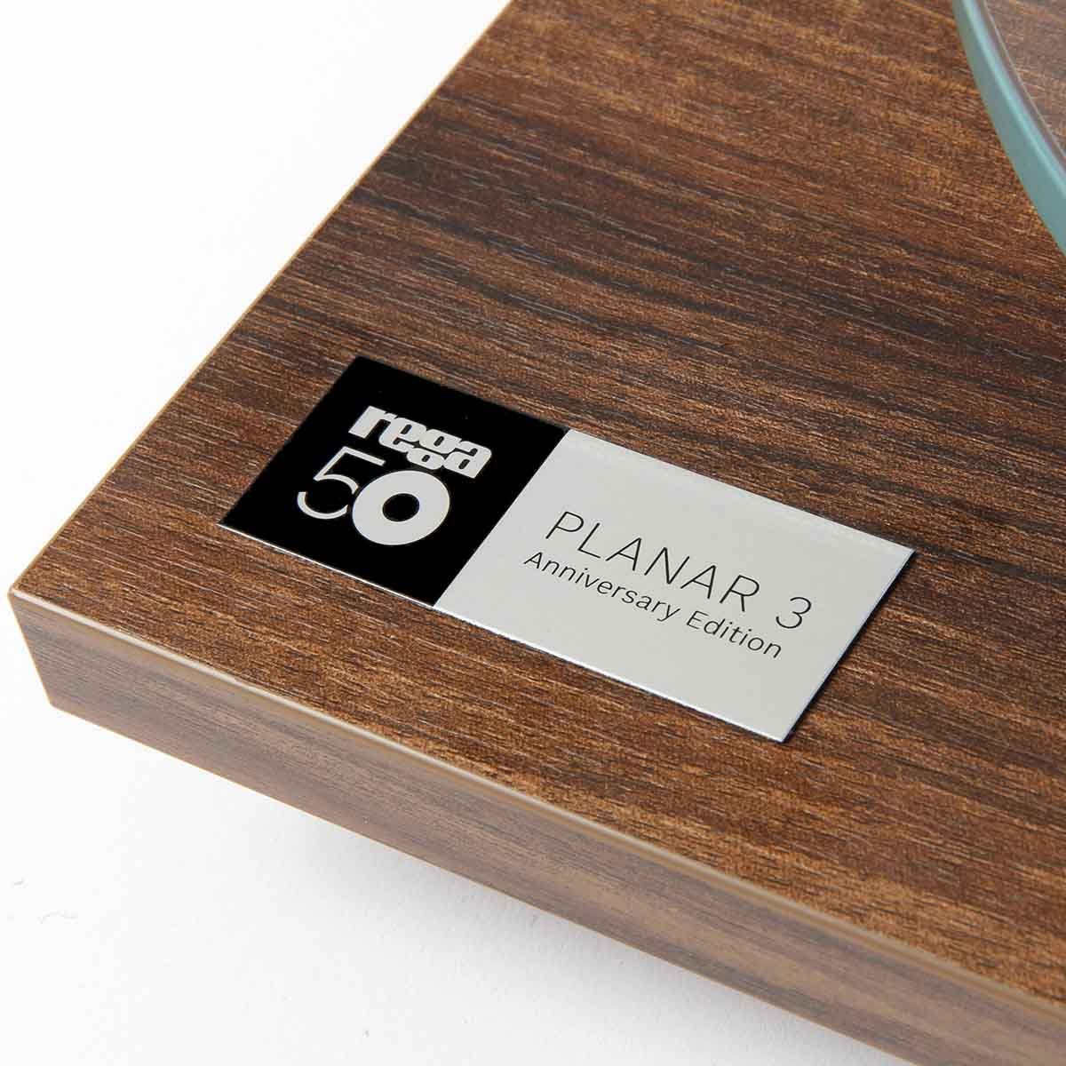 Rega Planar 3 50th Anniversary Edition Turntable - Walnut close-up of 50th Anniversary badge on plinth