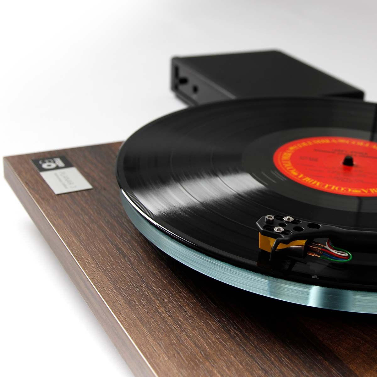 Rega Planar 3 50th Anniversary Edition Turntable - Walnut angled front view with record playing and Neo PSU