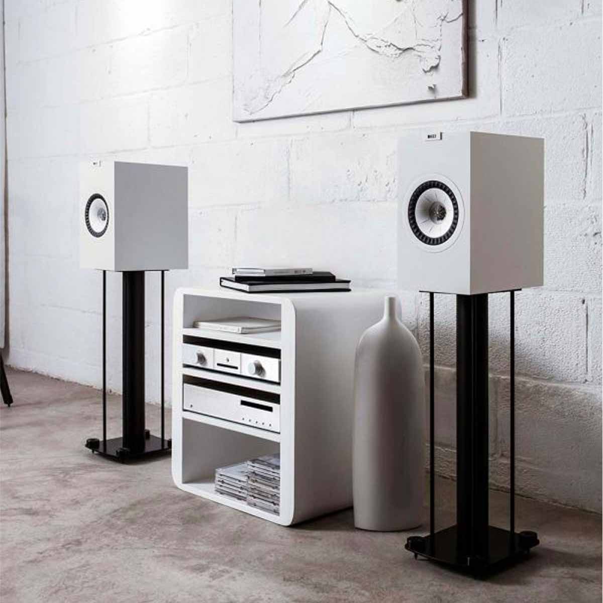 KEF Q350 Bookshelf Speaker - White - Pair - on speaker stands in listening room with equipment rack in between