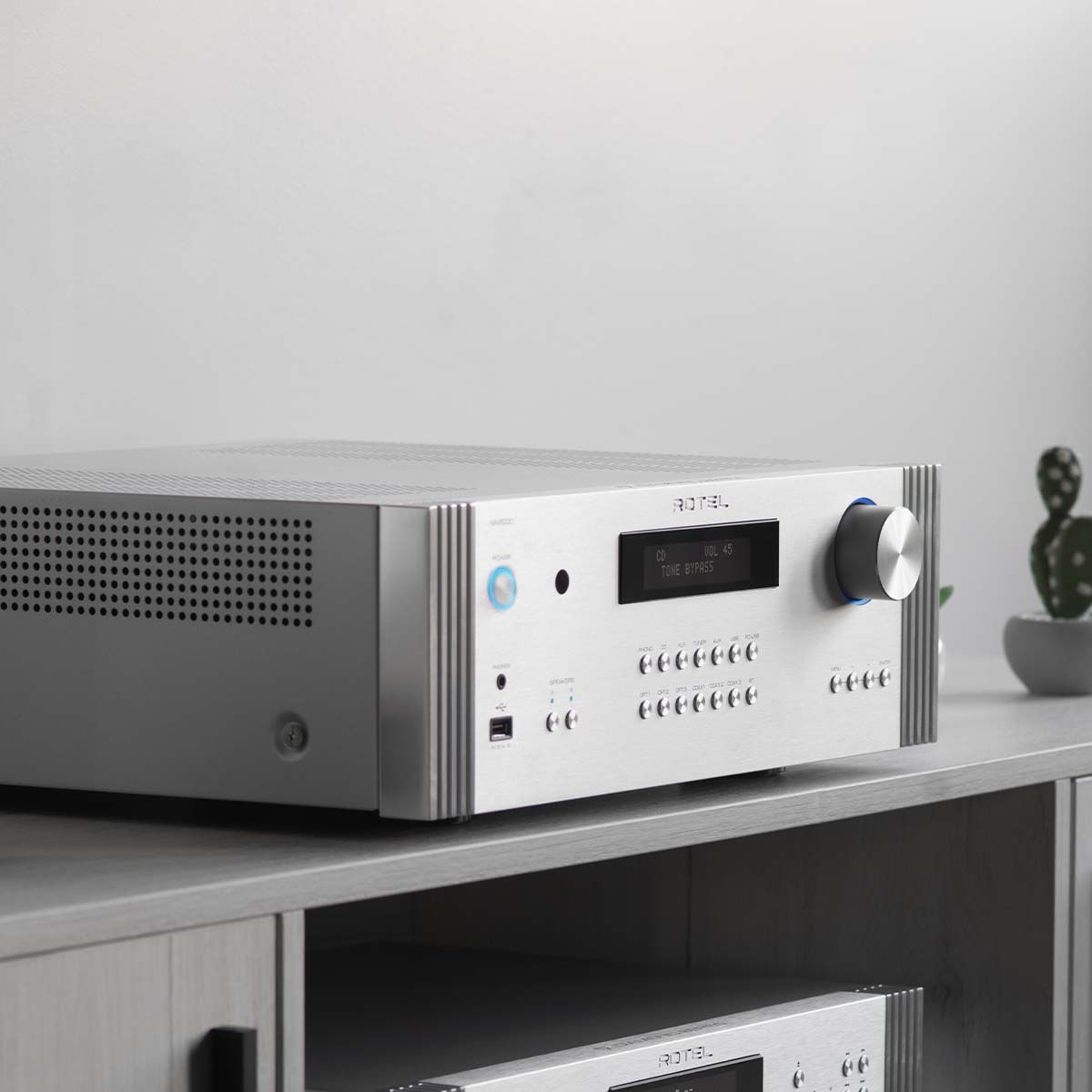 Rotel RA-6000 Integrated Amplifier - Silver - alternate angled front view on media stand