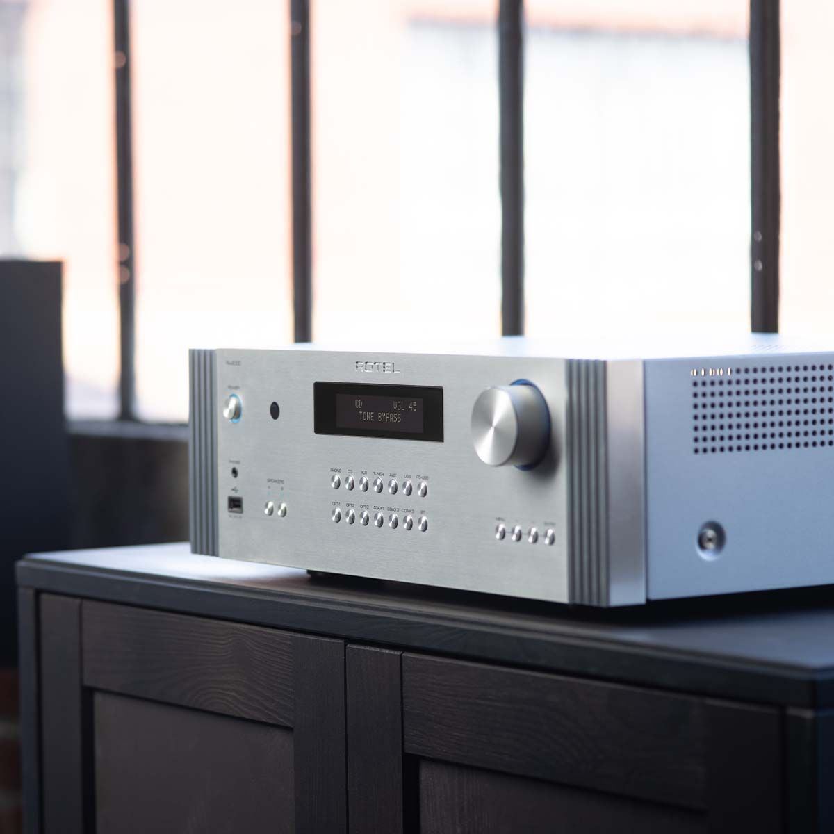 Rotel RA-6000 Integrated Amplifier - Silver - angled front view sitting on table