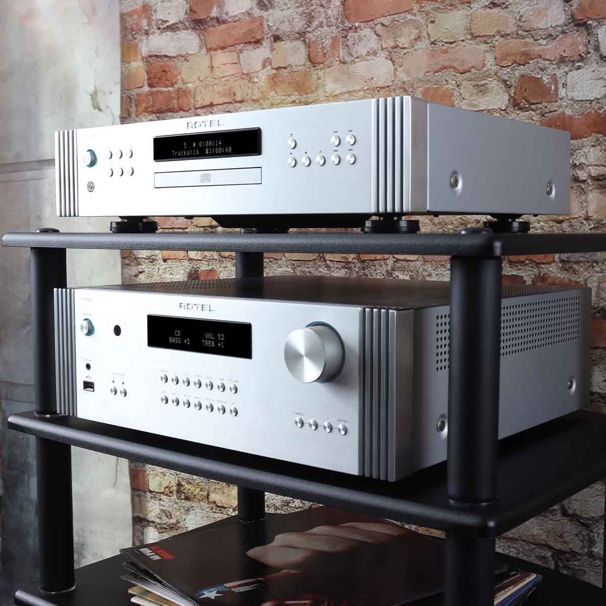 Rotel RA-6000 Integrated Amplifier - Silver - angled front view on component rack with matching DT-6000 DAC/CD transport