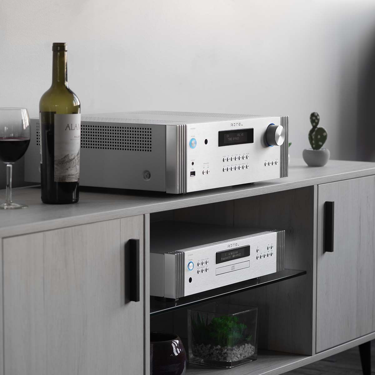 Rotel RA-6000 Integrated Amplifier - Silver - angled front view on media cabinet with matching DT-6000 DAC/CD transport