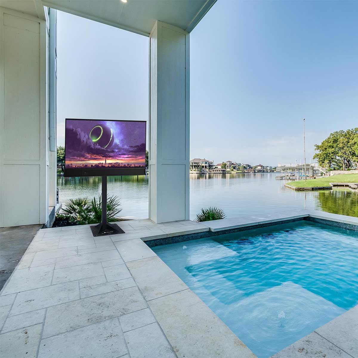 Séura Shade Series 2 4K UHD Outdoor TV, stand-mounted beside a pool