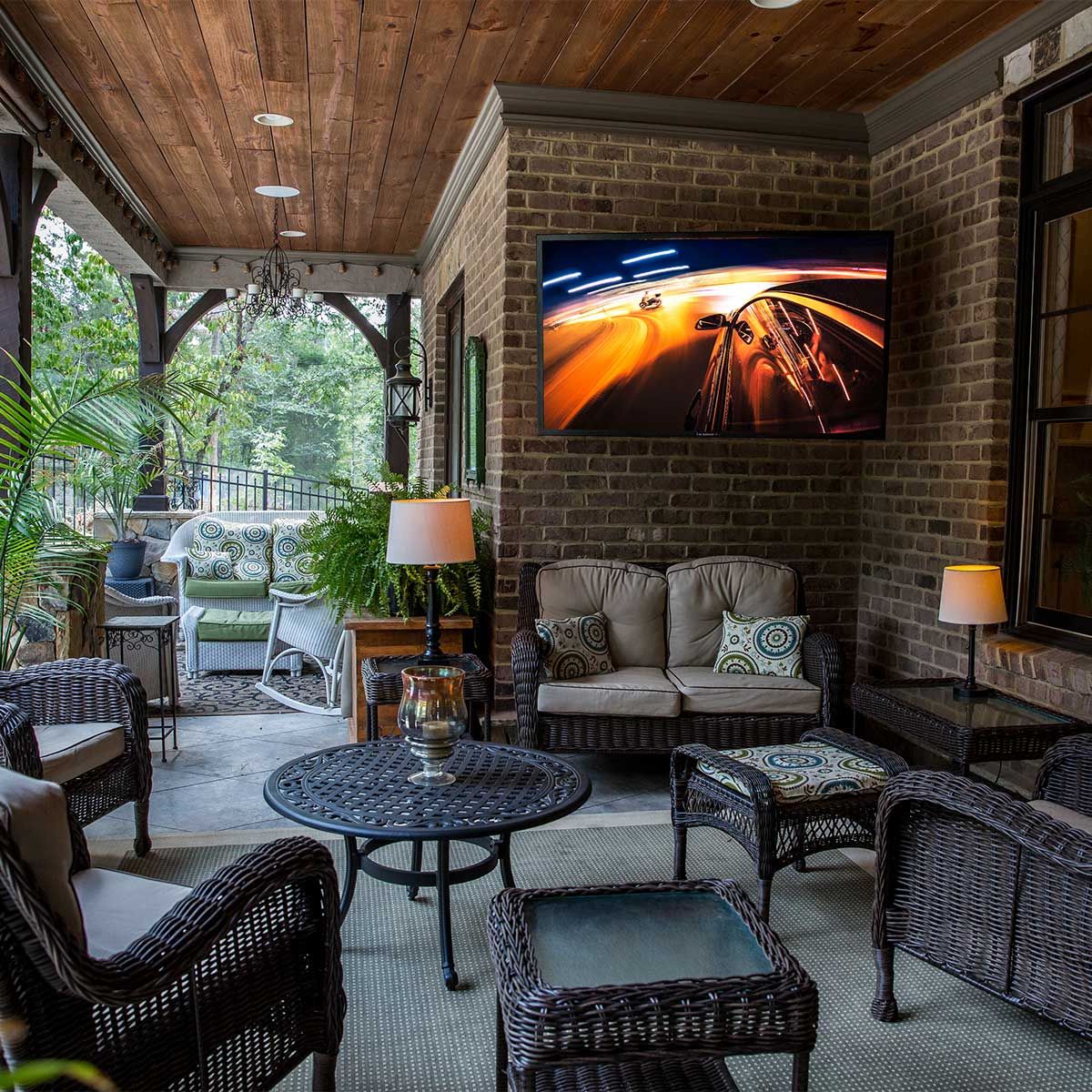 Sunbrite Veranda Full Shade Outdoor 4K LED TV, mounted on a shaded outdoor patio