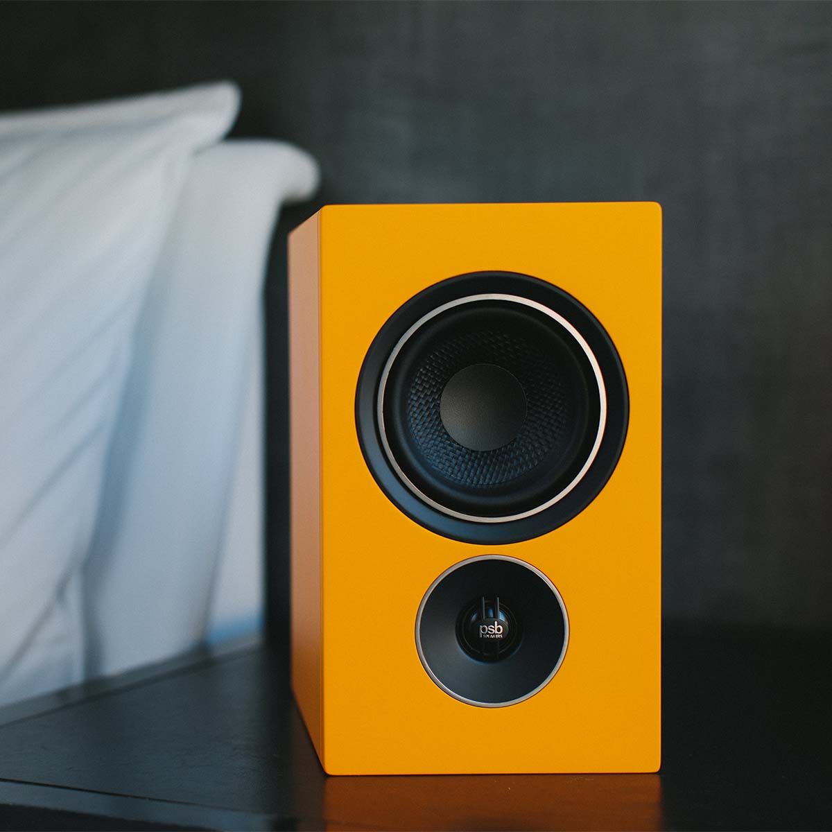 PSB Alpha iQ Streaming Powered Speakers - single orange - lifestyle image