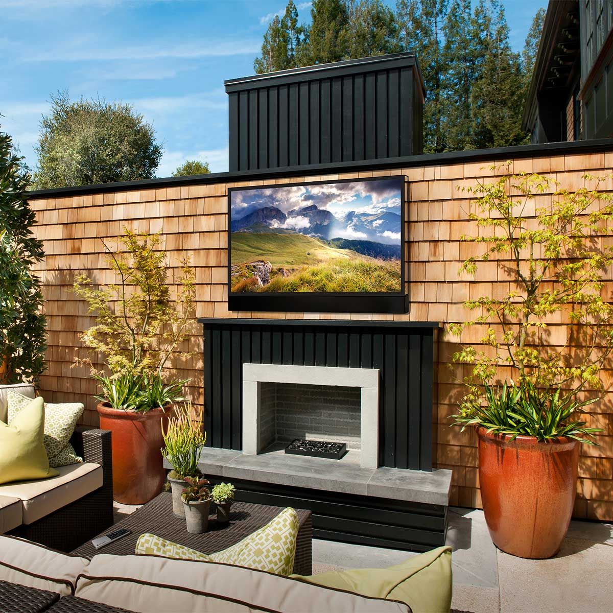 Seura Ultra Bright Outdoor 4K UHD TV, mounted above outdoor fireplace