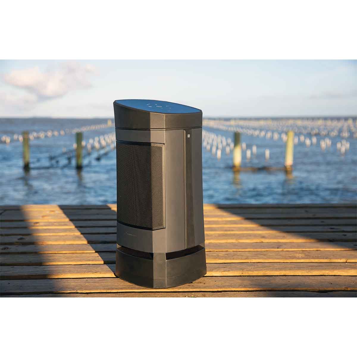 Close-up shot of the Soundcast VG5 Portable Waterproof Bluetooth Speaker's front view on a boat dock.