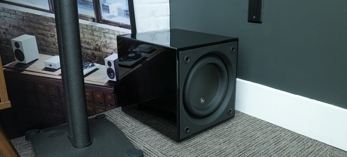 JL Audio Dominion d110 Subwoofer on the floor aganist a wall